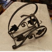 Antique iron drink holder with grape leaf pattern