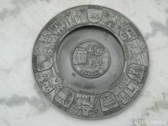 Marked pewter wall plate with relief pattern