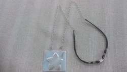 Silver pendant with silver and black leather chain