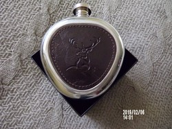 Flat glass with a leather insert depicting a deer
