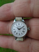 Women's chaika jewelry wristwatch in almost factory condition, with a used white wide strap.