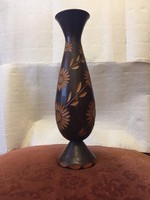 Hand-carved wooden vase with flower pattern
