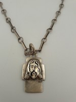 Ezüst lánc stilizált Jézus medállal