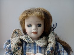 Porcelain doll in armchair (869)