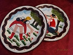 Granite porcelain decorative plate, . The boy plays the flute, the girl picks mushrooms. In a pair. For sale! Jokai.