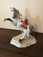 A foal figurine braking a Herend porcelain horse