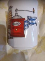 German tea cup with coffee grinder representation