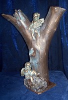 Angyali dallamok c. fából, kőből egyebekből készült bronzírozott szoborapplikáció. Károlyfi Zsófia