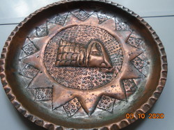 Eastern hand-made wall plate with a twerking, punched, ruffled rim.