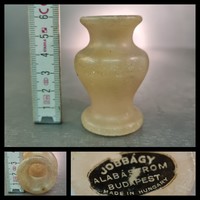 Small alabaster vase labeled 