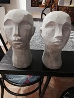 Férfi és női fej szobor