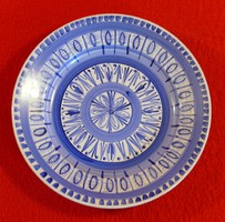 Blue patterned plate decorated with hand painting on a white background, 23.5 cm