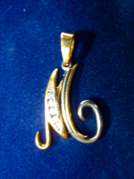 Antique white and yellow gold pendant in the shape of the letter m