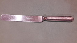 A knife with a silver-plated handle to make up for the gap