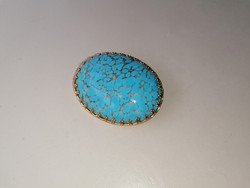 Bross kitűző kék színű kővel 