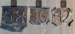Forged house number plate
