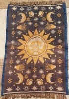 Cult carpet with star, moon and sun symbols.