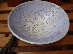 Craftsman shrinking a serving bowl