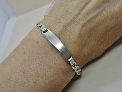 Beautiful patterned silver bracelet with silver plate decoration