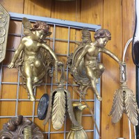 Pair of bronze, copper putto painted wall brackets.27 Cm