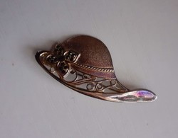 Retro hat-shaped brooch with small black stones and a safety pin