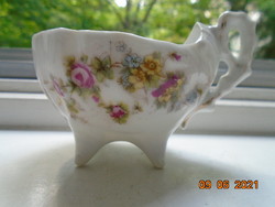 Antique boat shaped coffee cup with decorative pliers on 4 small legs, embossed, floral pattern