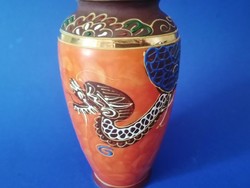 Oriental satsuma-style porcelain vase with a dragon pattern