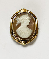 Gold-plated, cameo brooch with relic holder.
