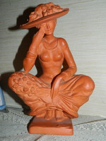 Lady Alexander Kligl in a terracotta hat.