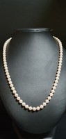 Example of perfection: akoya string of pearls with gold clasp