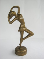 Copper statue of dancing woman