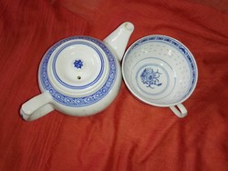 Rice patterned porcelain tea cup and pourer.