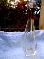 Glass bottle with polished metal neck