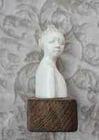 Antique oriental bone sculpture on wooden pedestal