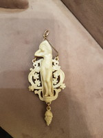 Bone pendant with a tiny gold chain