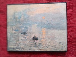 A print of Claude Monet's painting of the rising sun