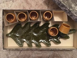 Retro ceramic pile of oak leaves on tray in hunter's house