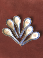 Set of six rice spoons with rice grains