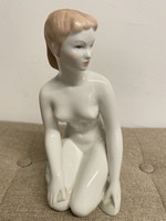 Woman kneeling in aquincum porcelain