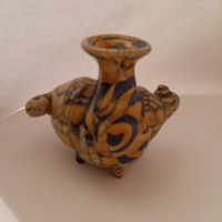 Interesting candlestick in the shape of a stylized snail