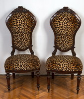 Two ocelot patterned chairs