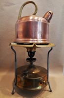 Old german bat on brass kerosene stove