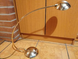 Art deco copper table lamp with large halogen bulb.