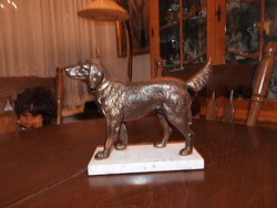 Antique bronzed shepherd dog on marble pedestal