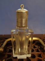 Antique perfume bottle with silver cap
