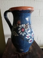 Old milky jug with floral pattern