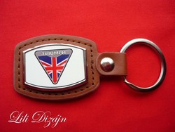 Triumph (motorized) metal keychain on a leather background