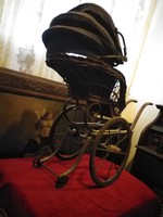 Old toy stroller with gift doll