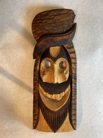 Man with carved wall mask