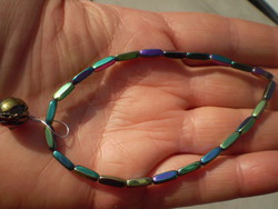 Iridescent hematite bracelet with fossil pearls